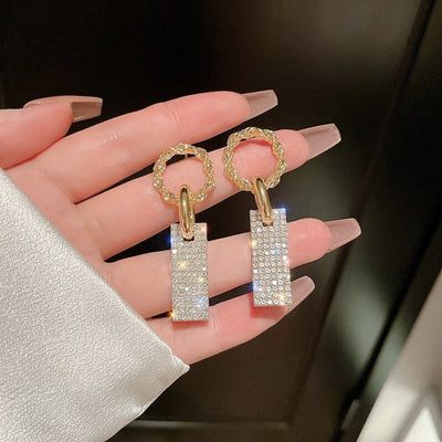 Caravanas Circonitas Lujosas en Plata y Baños con Brillantitos Incrustados